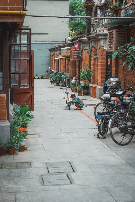 Child on Tricycle in Shanghai Alley