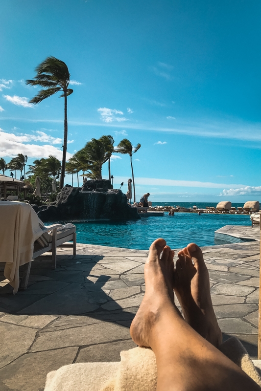 Feet Rest Over Turquoise Lagoon