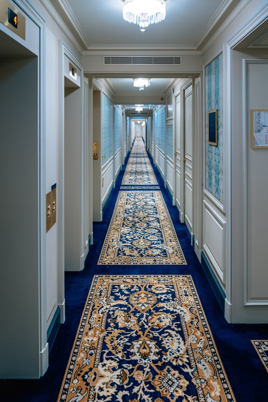 Elegant Hotel Corridor With Symmetrical Doors