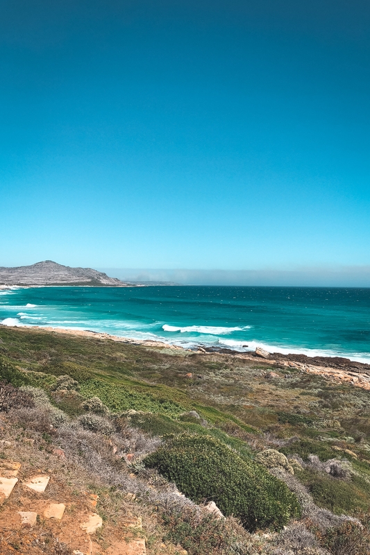 Turquoise Waves Meeting Sandy Coastline