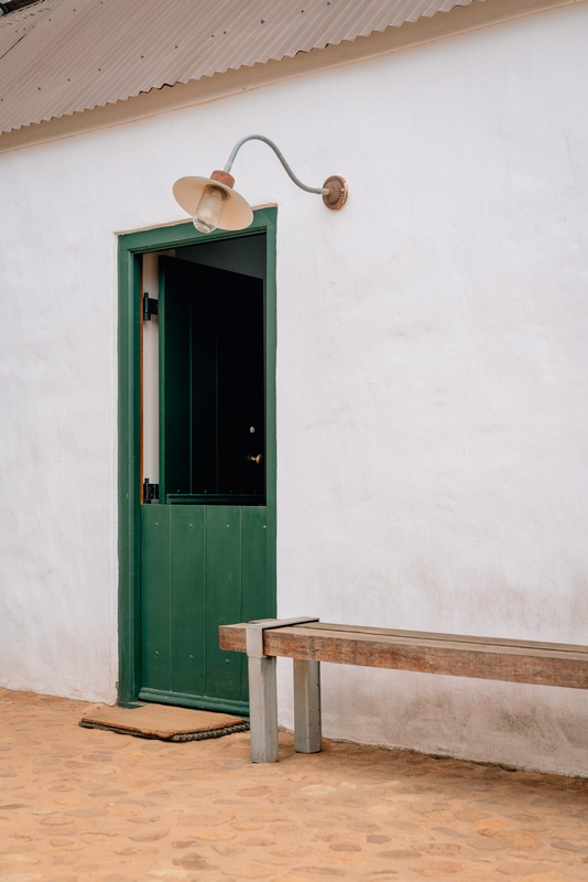 Green Door With Copper Lamp