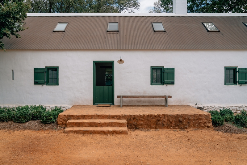 Rustic White Farmhouse With Green Shutters