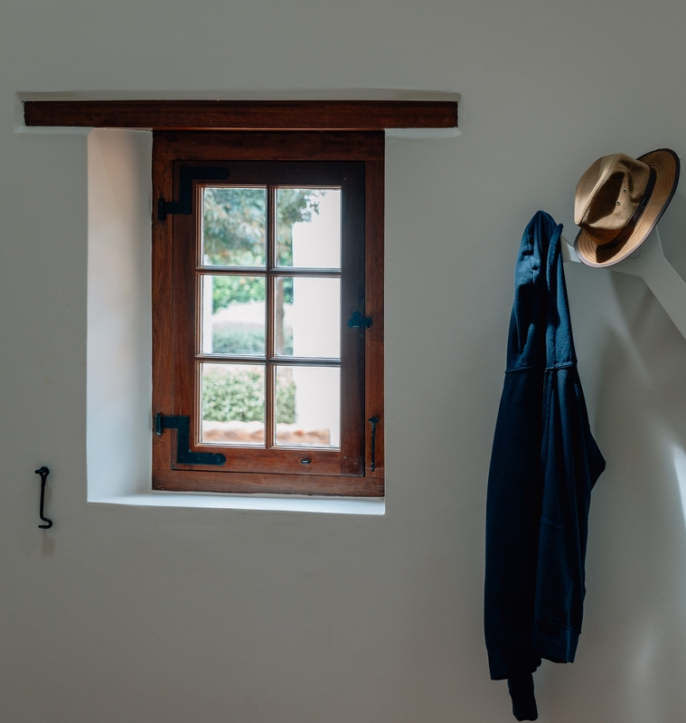 Rustic Window Overlooking Garden With Hat