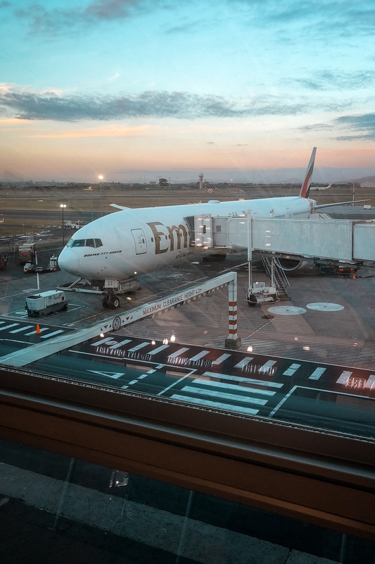 Emirates Aircraft At Gate During Twilight