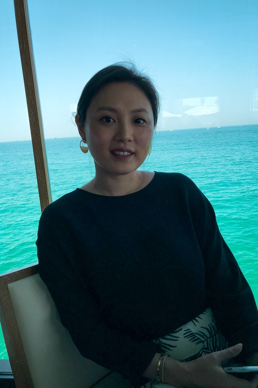 Woman Smiling on Boat at Sea