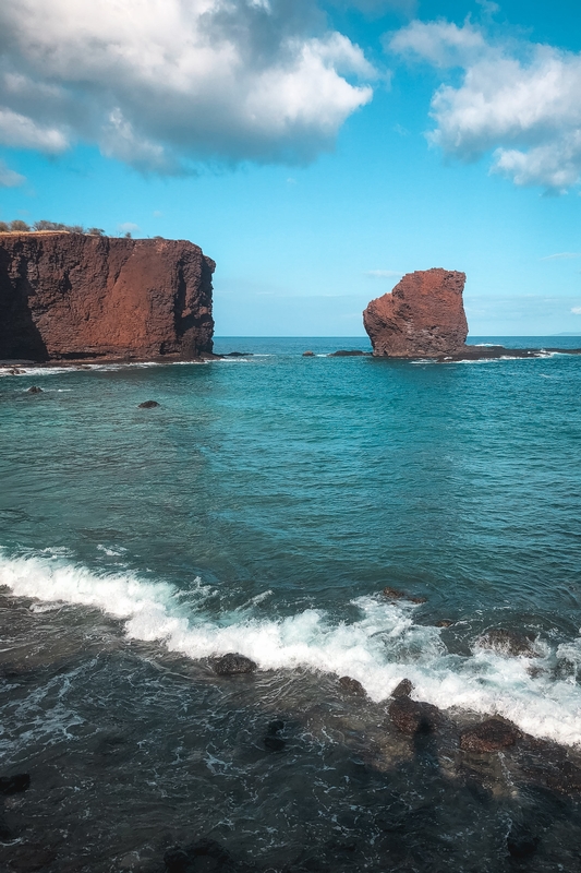 Turquoise Waves Meet Red Volcanic Rocks
