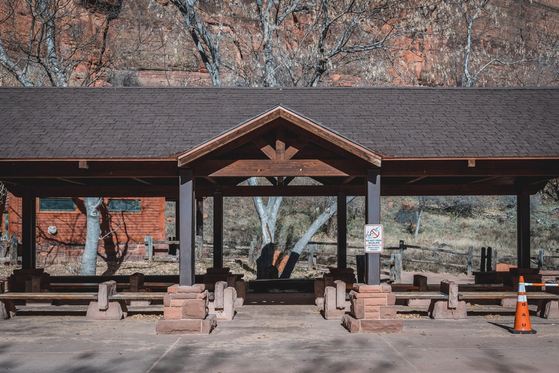 Rustic Pavilion Beneath Red Canyon Cliffs
