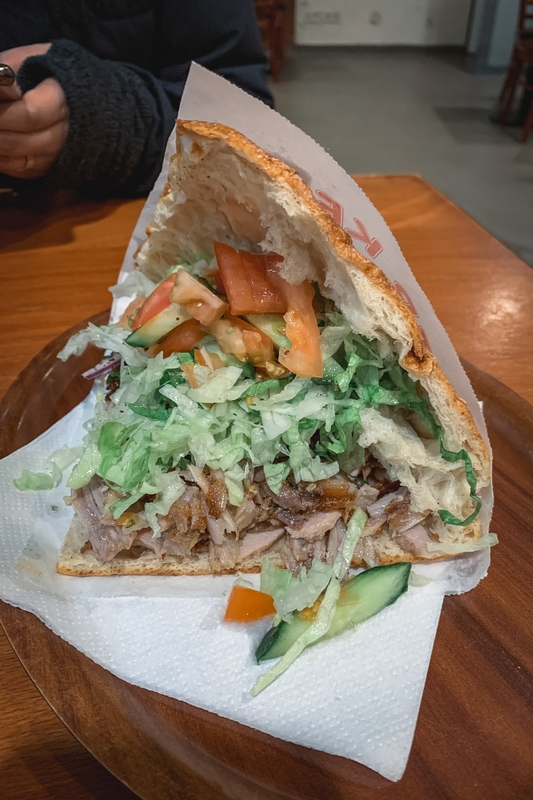 Hand Holding Fresh Sandwich Indoors