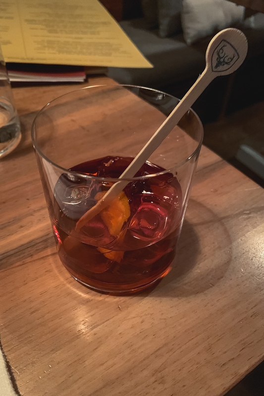Dark Cocktail With Branded Spoon
