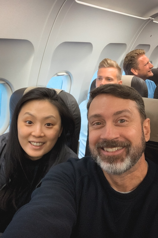 Smiling Passengers on Commercial Flight