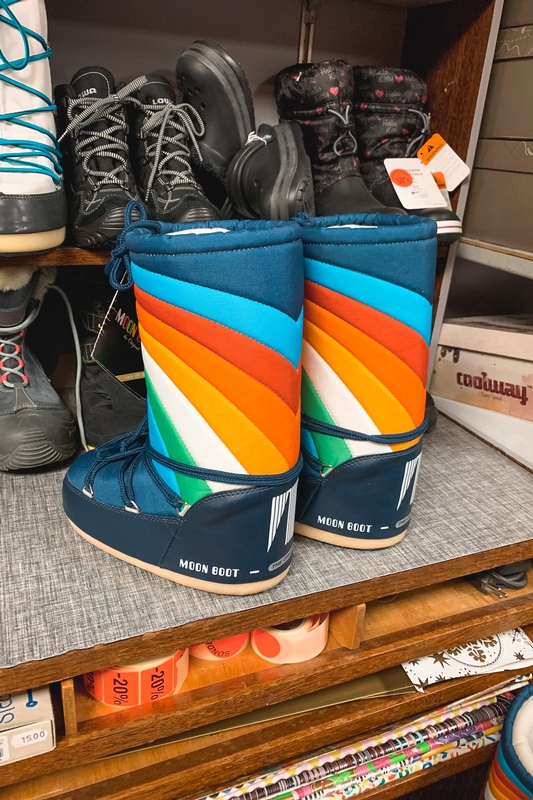 Colorful Moon Boots On Wooden Shelf