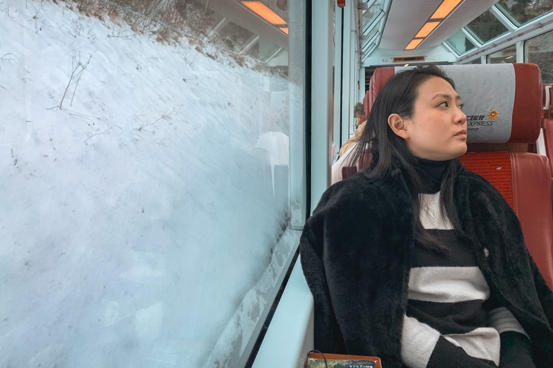 Woman Watching Alpine Snows From Train
