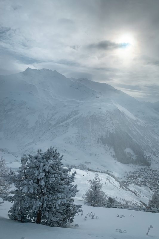 Snow-Covered Mountain Valley at Sunrise