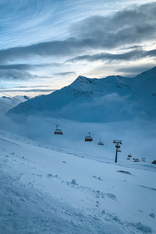 Ski Lift Cabins Over Alpine Slope