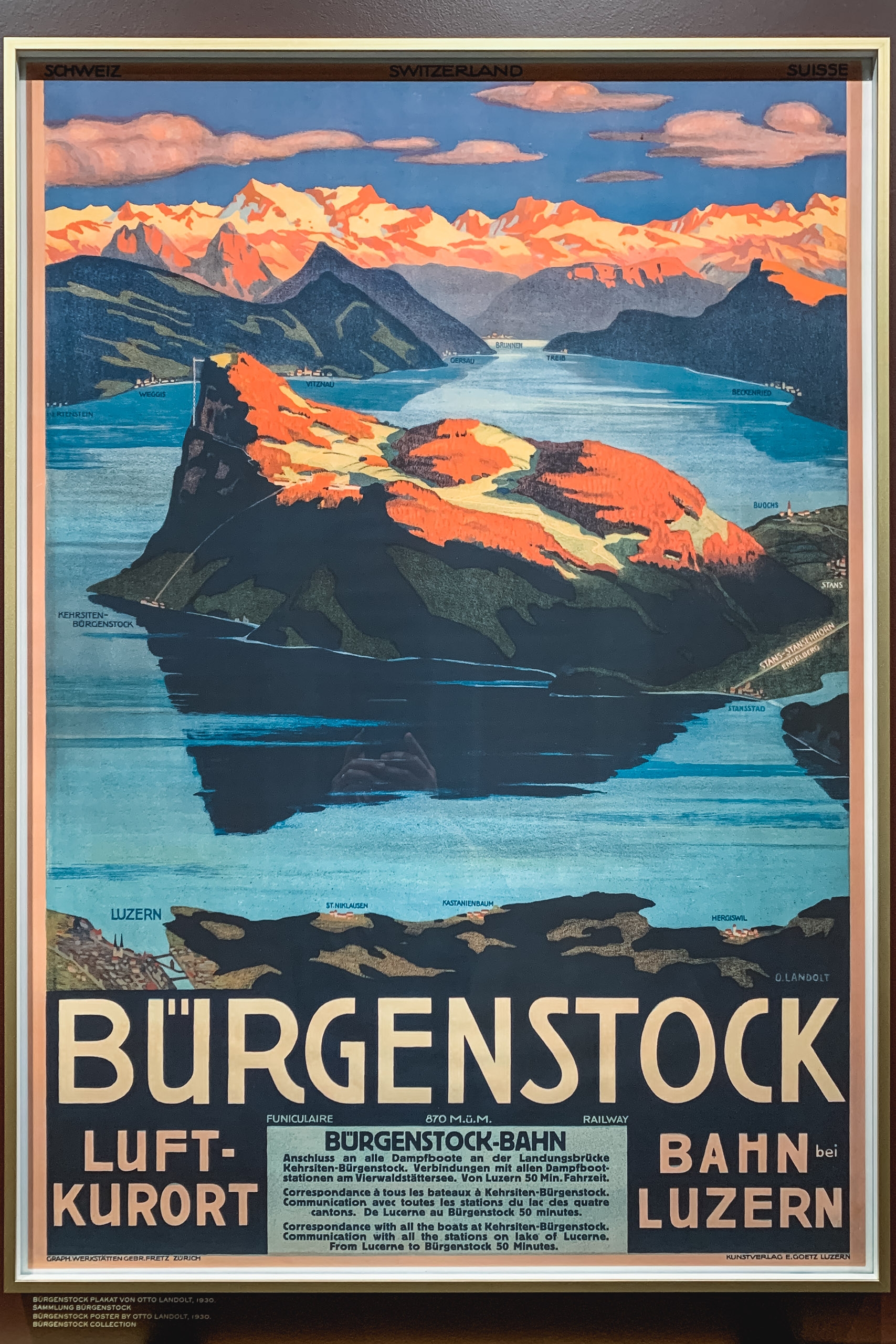 Vintage Swiss travel poster featuring Bürgenstock with golden-lit mountains, turquoise lake, and dark rocky outcroppings under a blue sky with pink clouds.