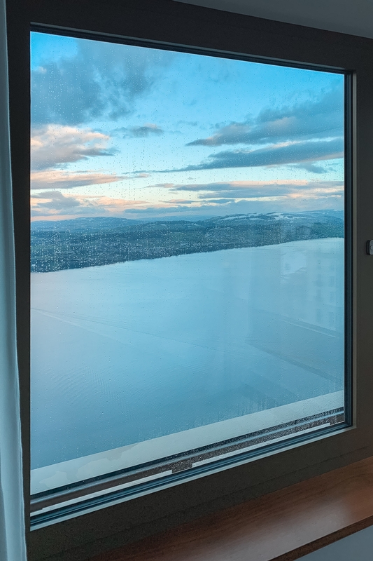 Alpine Twilight Through Mountain Window