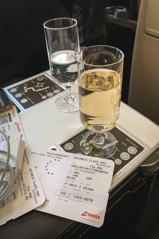 Beverages and Receipt on Airplane Tray