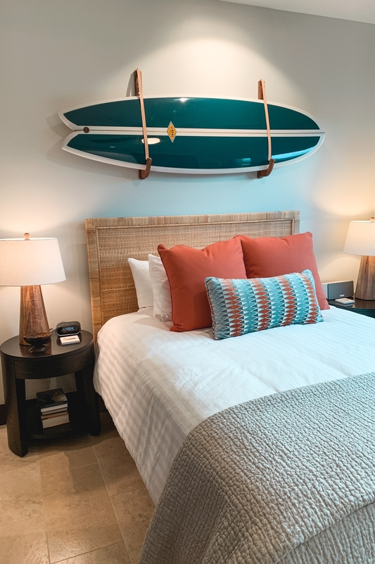 Coastal Bedroom With Surfboards and Teal Accents