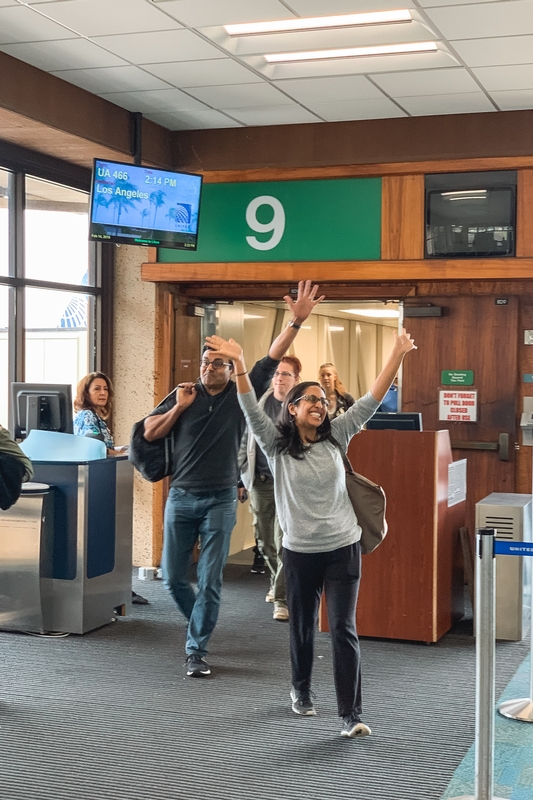 Travelers Celebrate at Airport Gate Nine