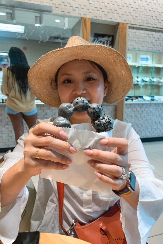 Woman With Pastries in Café