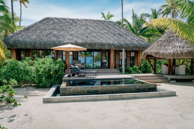 A View of the Backyard Pool, Deck and Dining Area