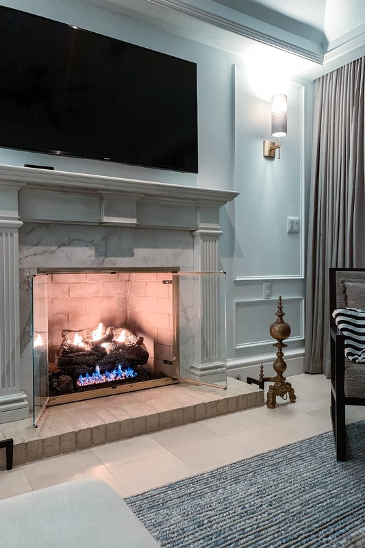 Modern Fireplace With Blue Flames and Television