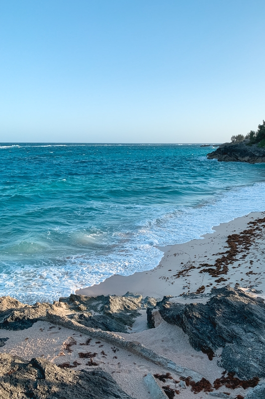 Turquoise Waves on Pink Sand Beach
