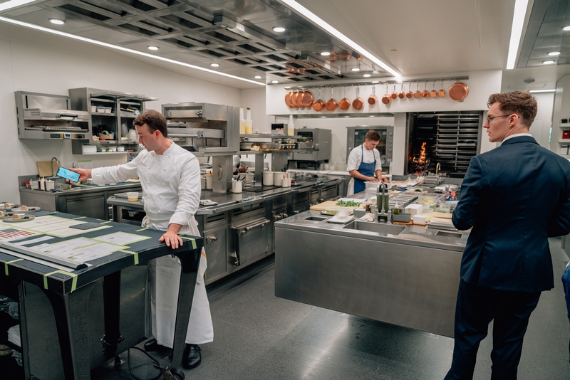 Chefs Preparing Meal Under Professional Observation