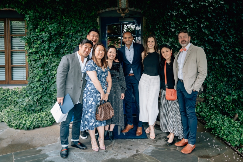 Seven Professionals at Ivy-Covered Entrance
