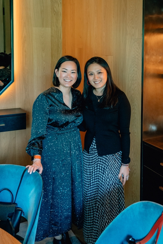 Two Women in Wooden Interior Space