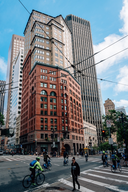 Historic Brick Building Among Modern Skyscrapers