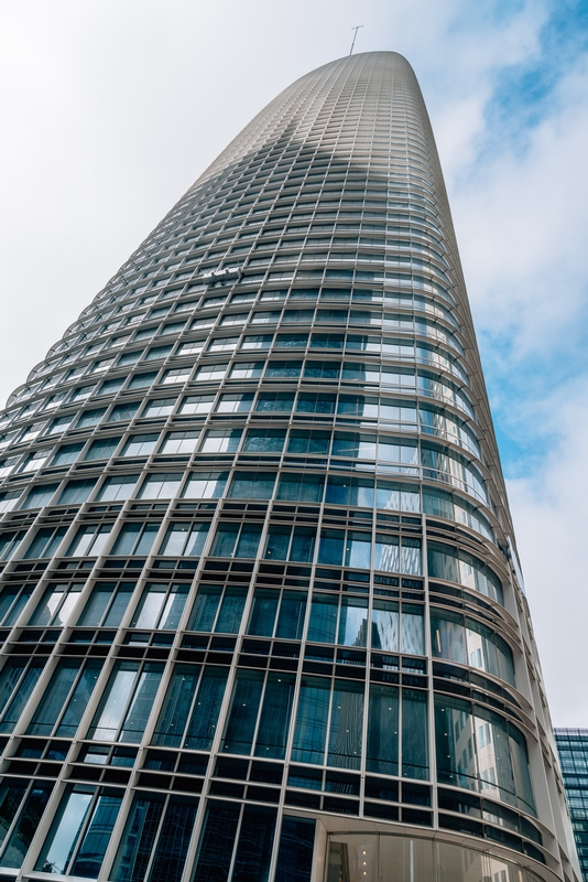Modern Cylindrical Skyscraper Reflecting Sky