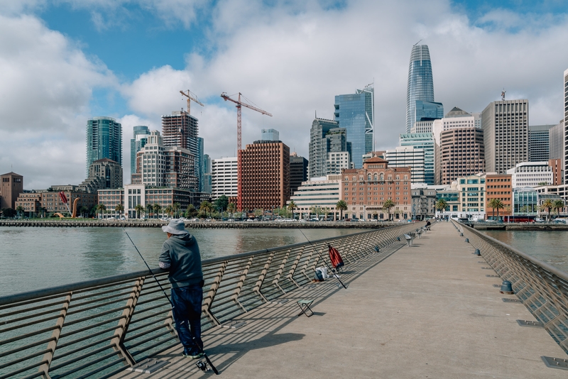 Solitary Figure Gazing at San Francisco Skyline