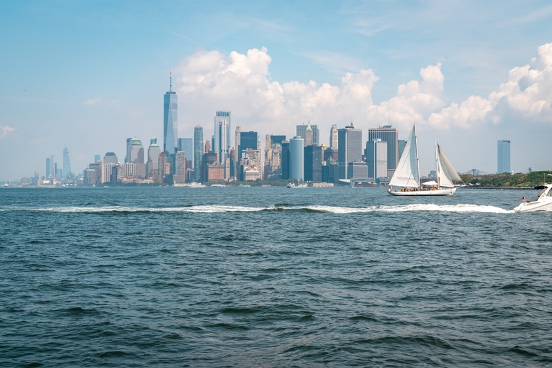 Sailboat Gliding Past Manhattan Skyline