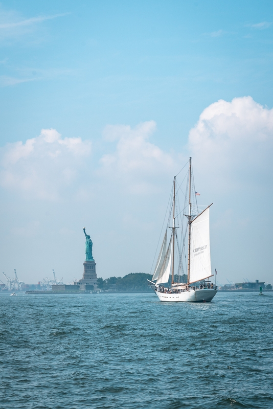 Sailing Schooner Near Statue of Liberty