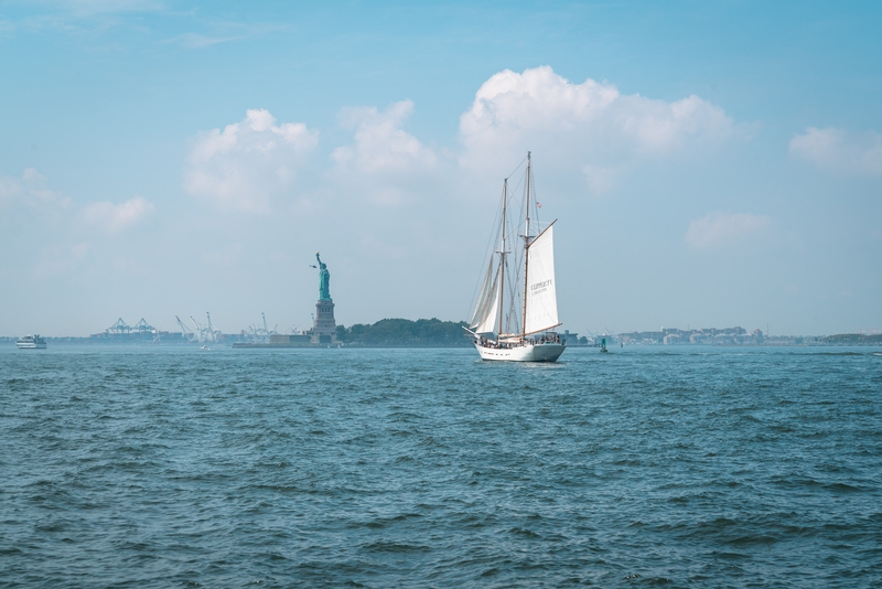 Sailing Vessel Near Statue of Liberty