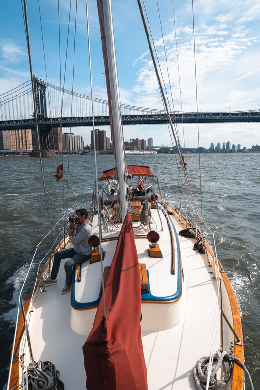 Sailboat Under Brooklyn Bridge