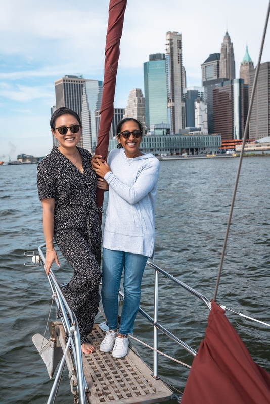 Women on Sailboat With Manhattan Skyline