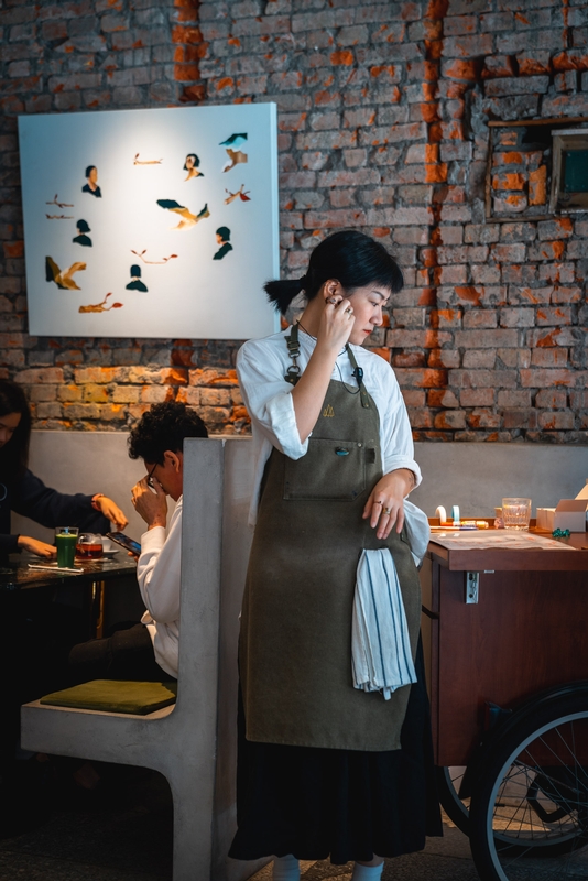 Artist in Green Apron Studio