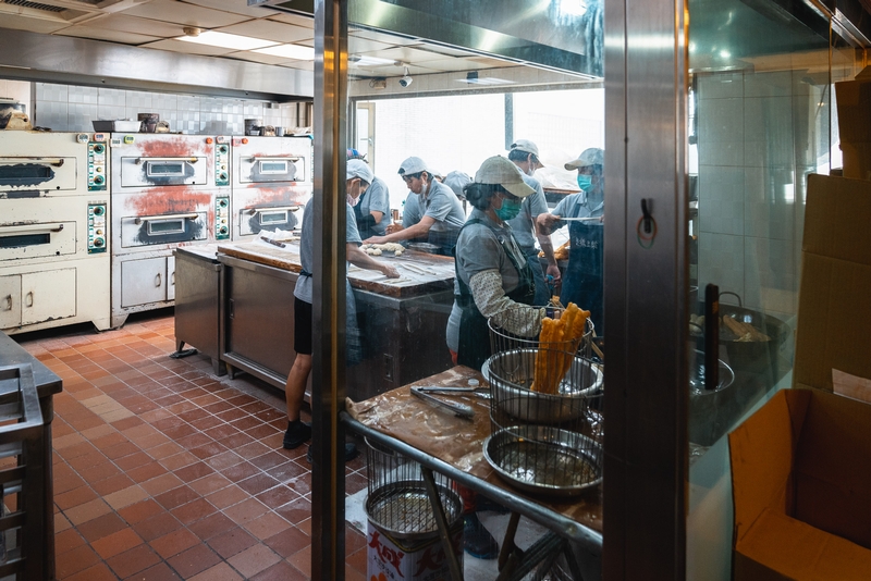 Commercial Kitchen Food Preparation Behind Glass