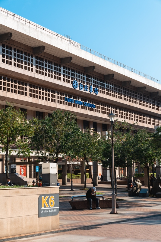 Brutalist Building With Blue Signage