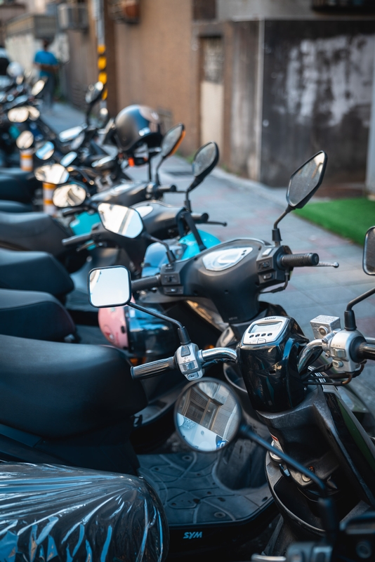 Blue and Black Scooters on Urban Street
