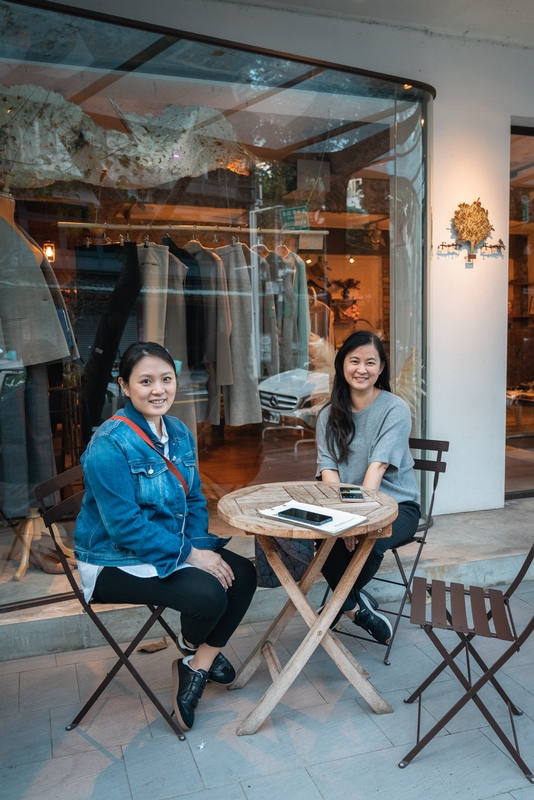 Two Women Outside Fashion Boutique