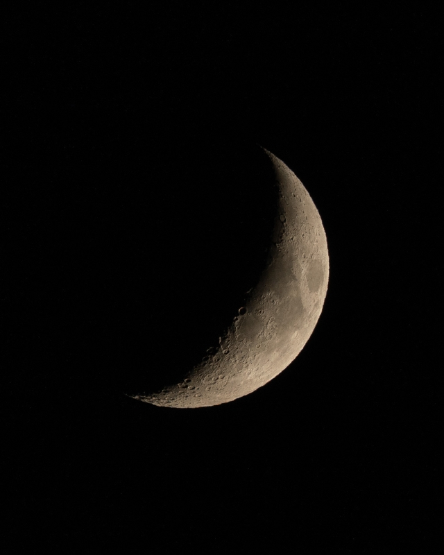 An Orange Crescent Moon