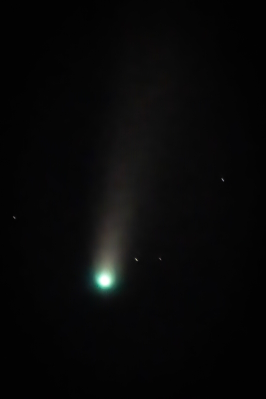 Luminous Comet With Glowing Green Nucleus