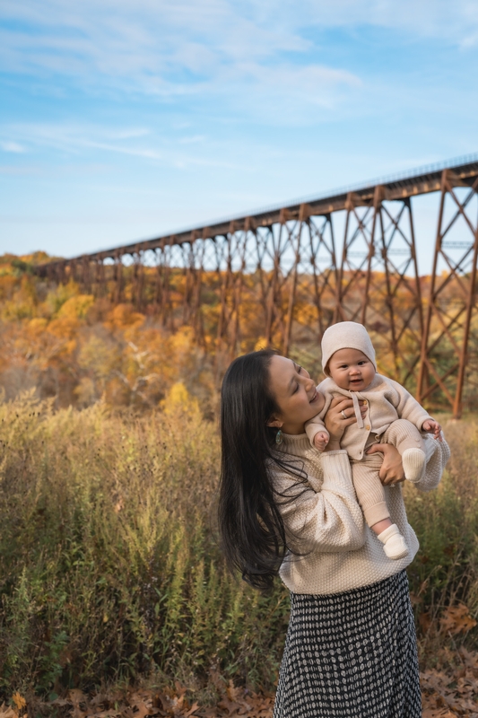 Mother and Infant Before Autumn Bridge