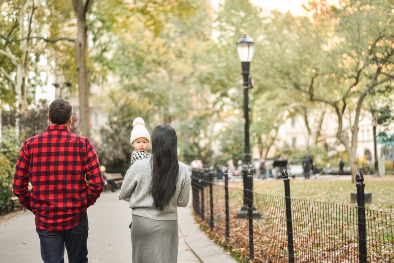 Family Walk Through Autumn Park