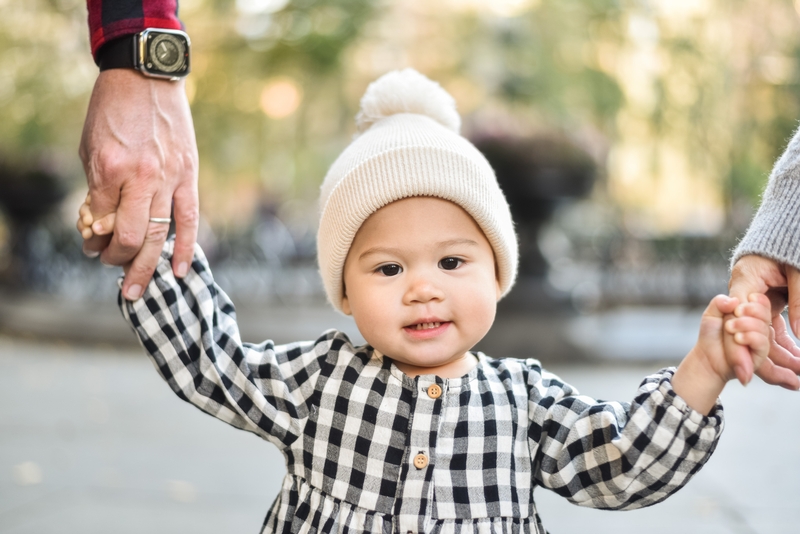 Toddler Holding Hands With Adults