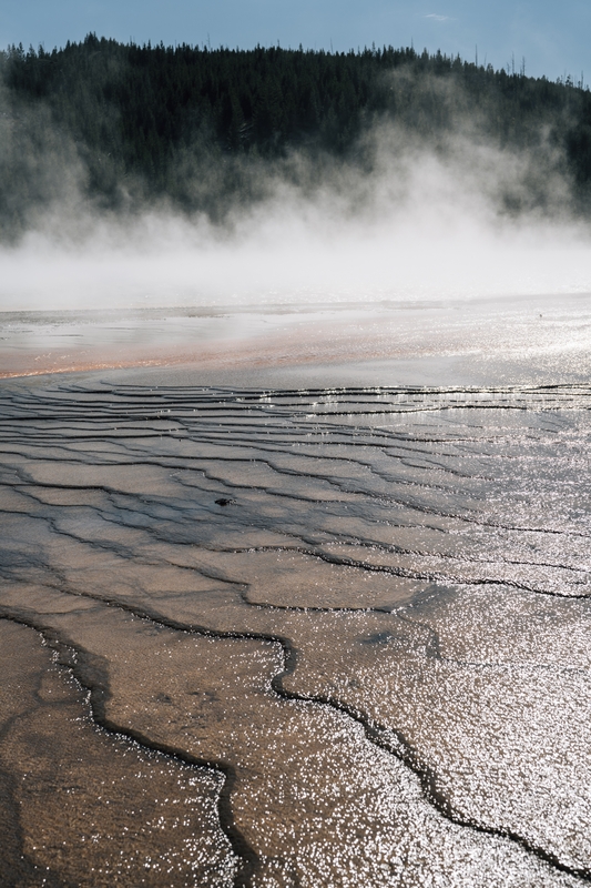 Misty Hot Spring With Mineral Deposits