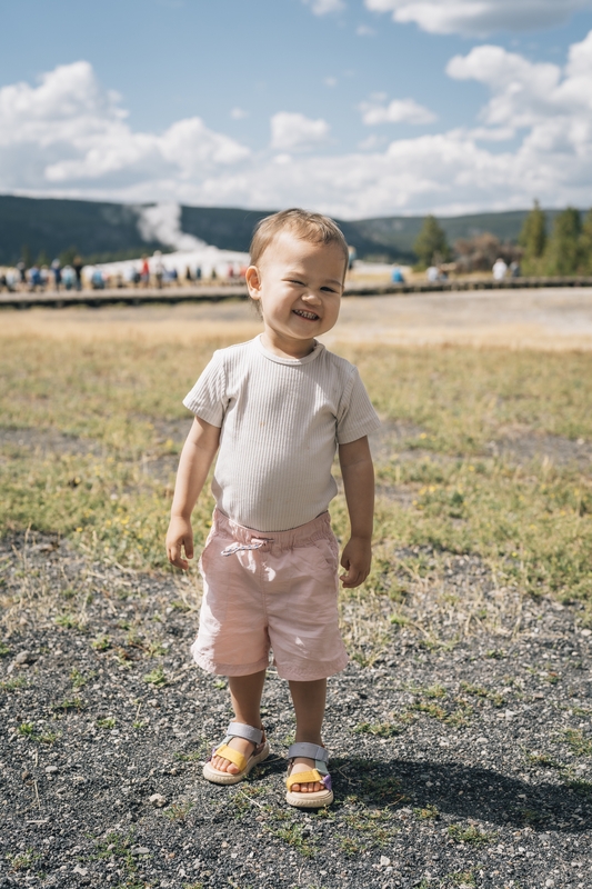 Toddler at Yellowstone's Old Faithful
